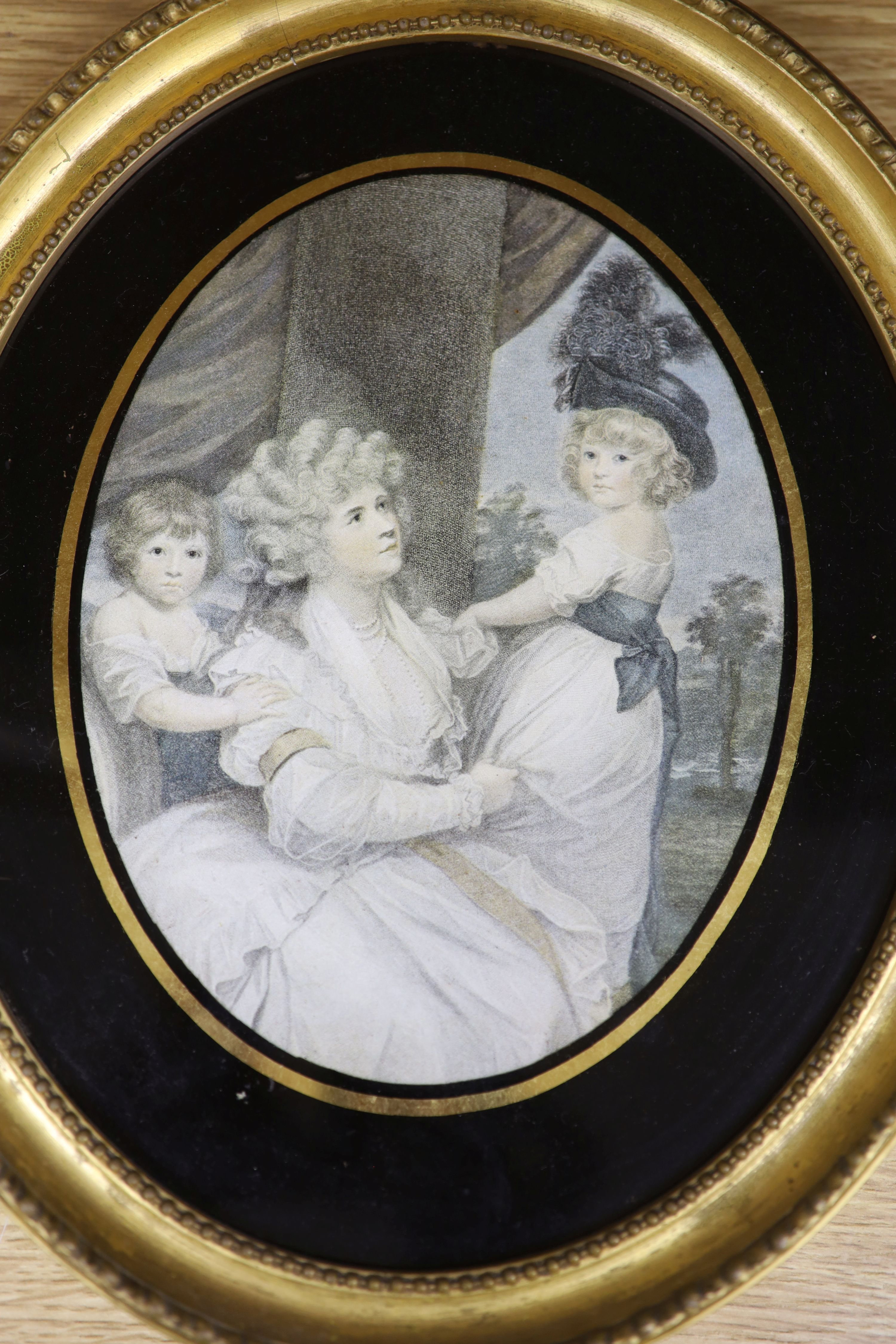 Continental School c.1900, oil on zinc, Coastal landscape, tondo, 11cm and an oval colour print after Reynolds